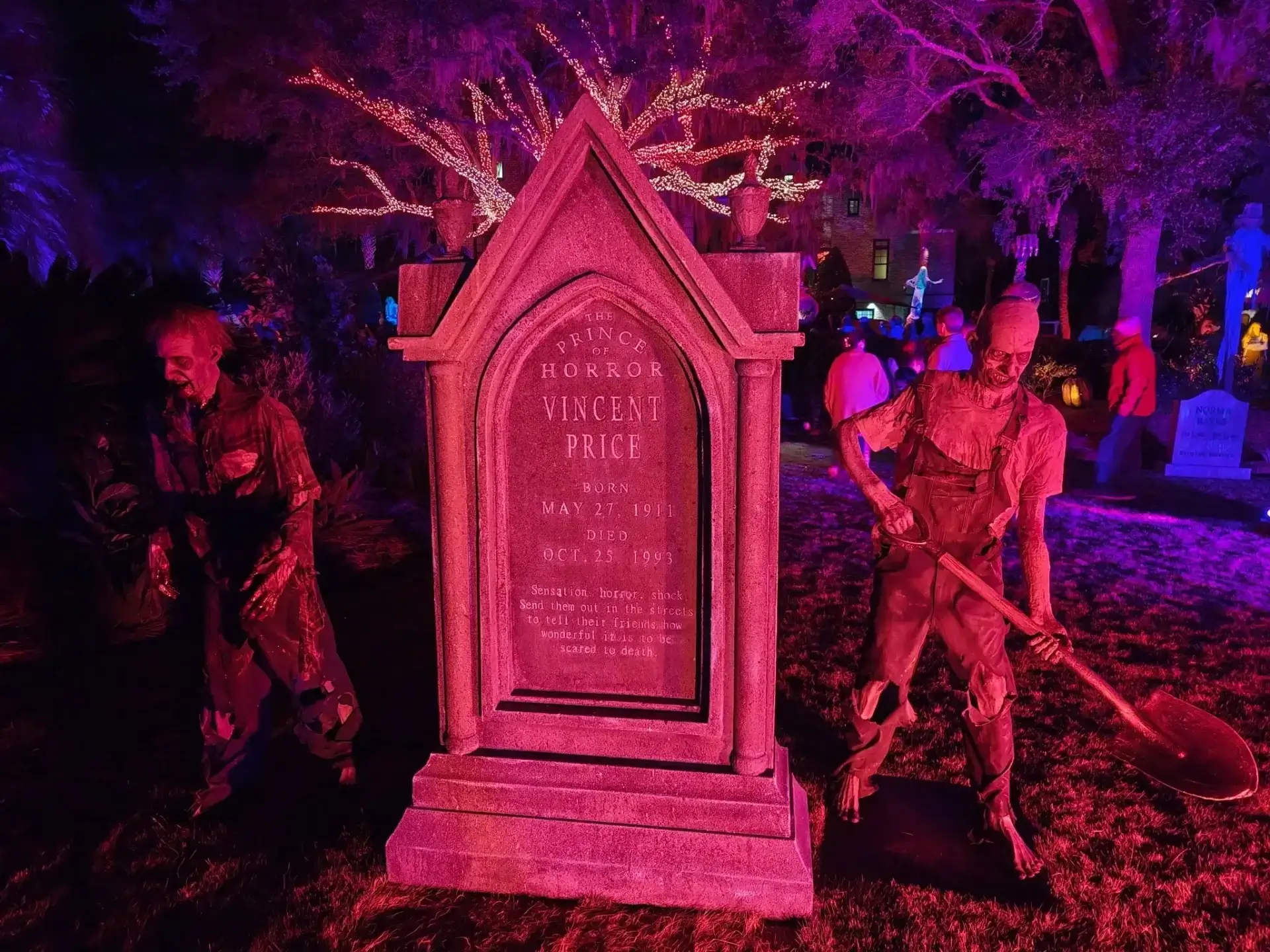 Haunted graveyard scene with eerie purple lighting.
