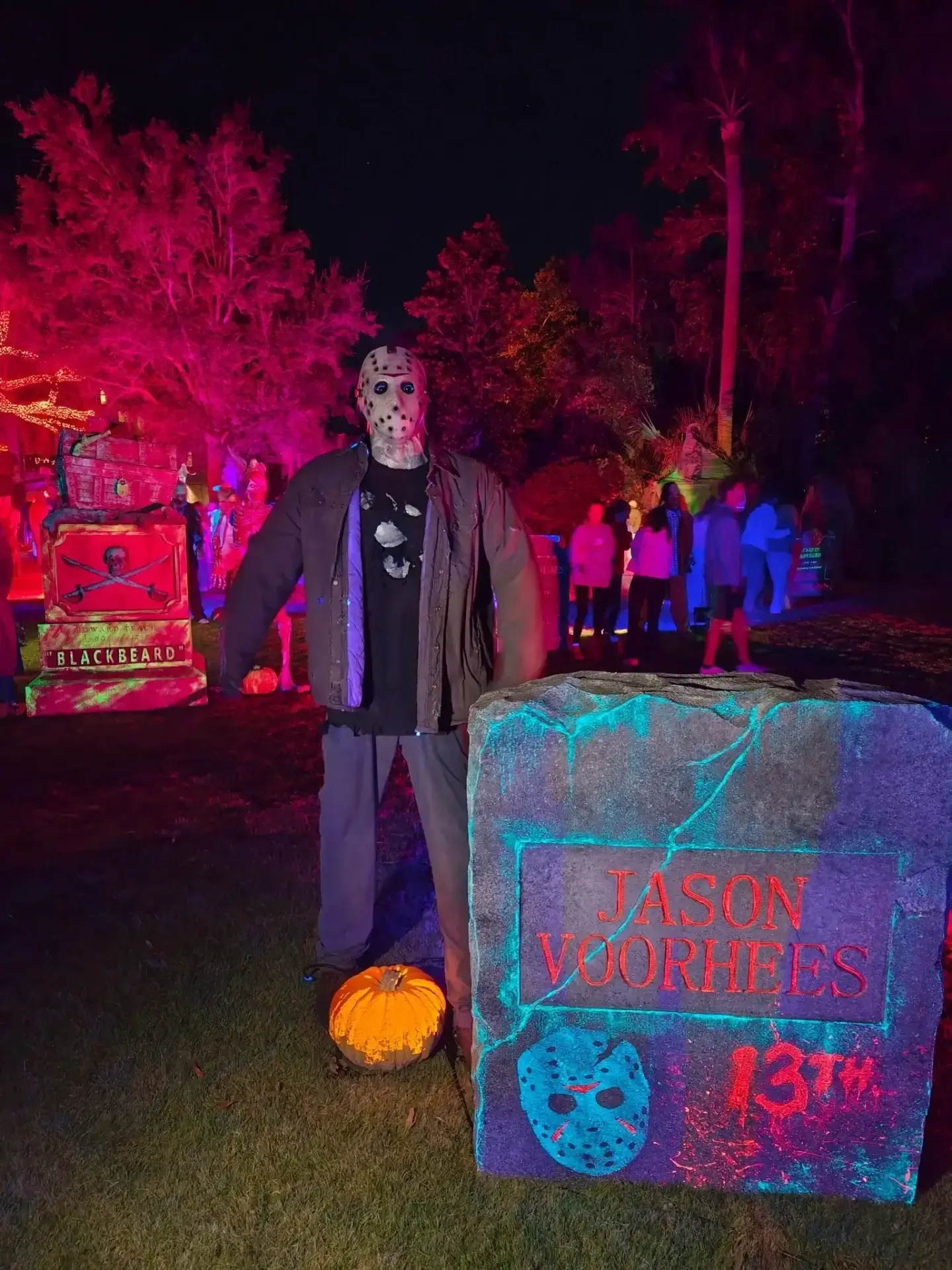Halloween display featuring Jason Voorhees statue.