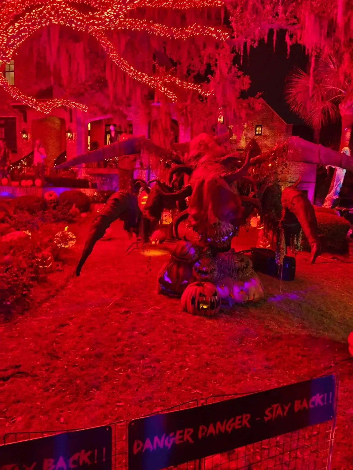 Halloween display with red lights and decorations.