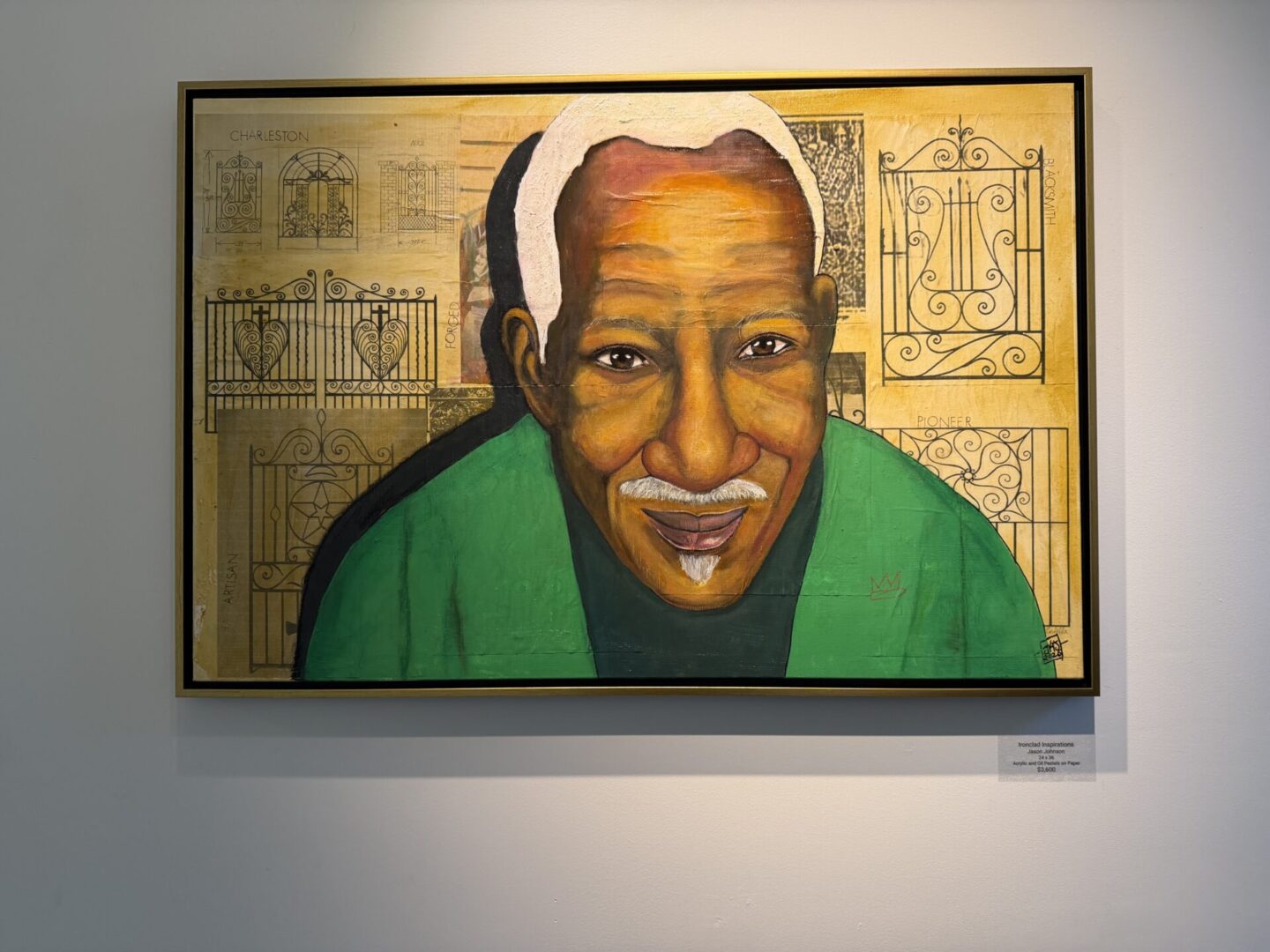 Portrait of a smiling elderly man painting.