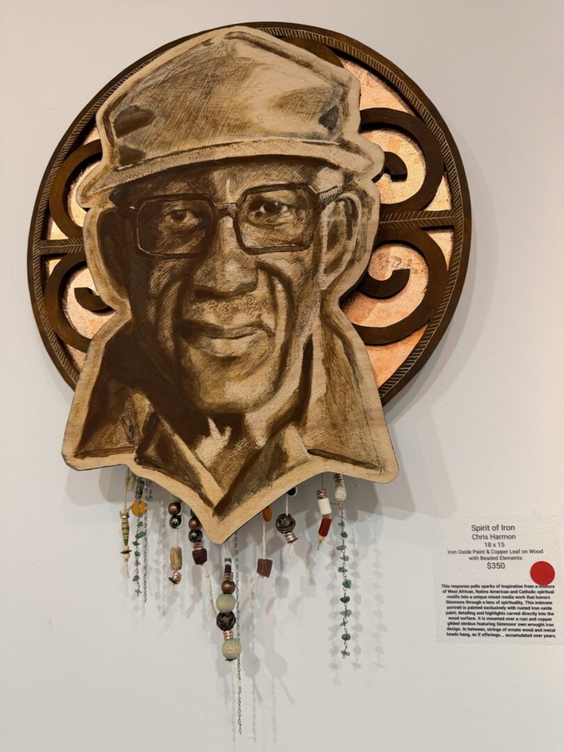 Wooden portrait sculpture with beads and patterns.