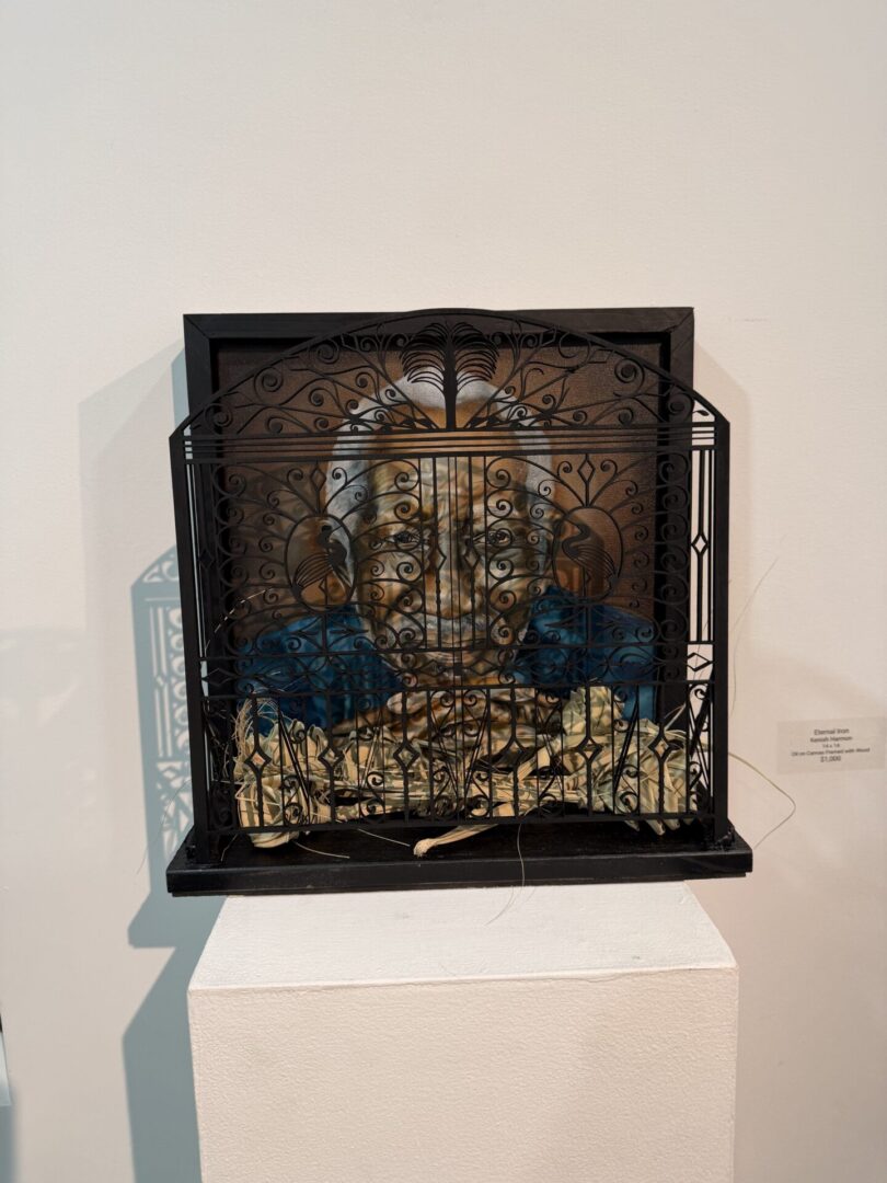 Artwork of elderly man behind wrought iron.