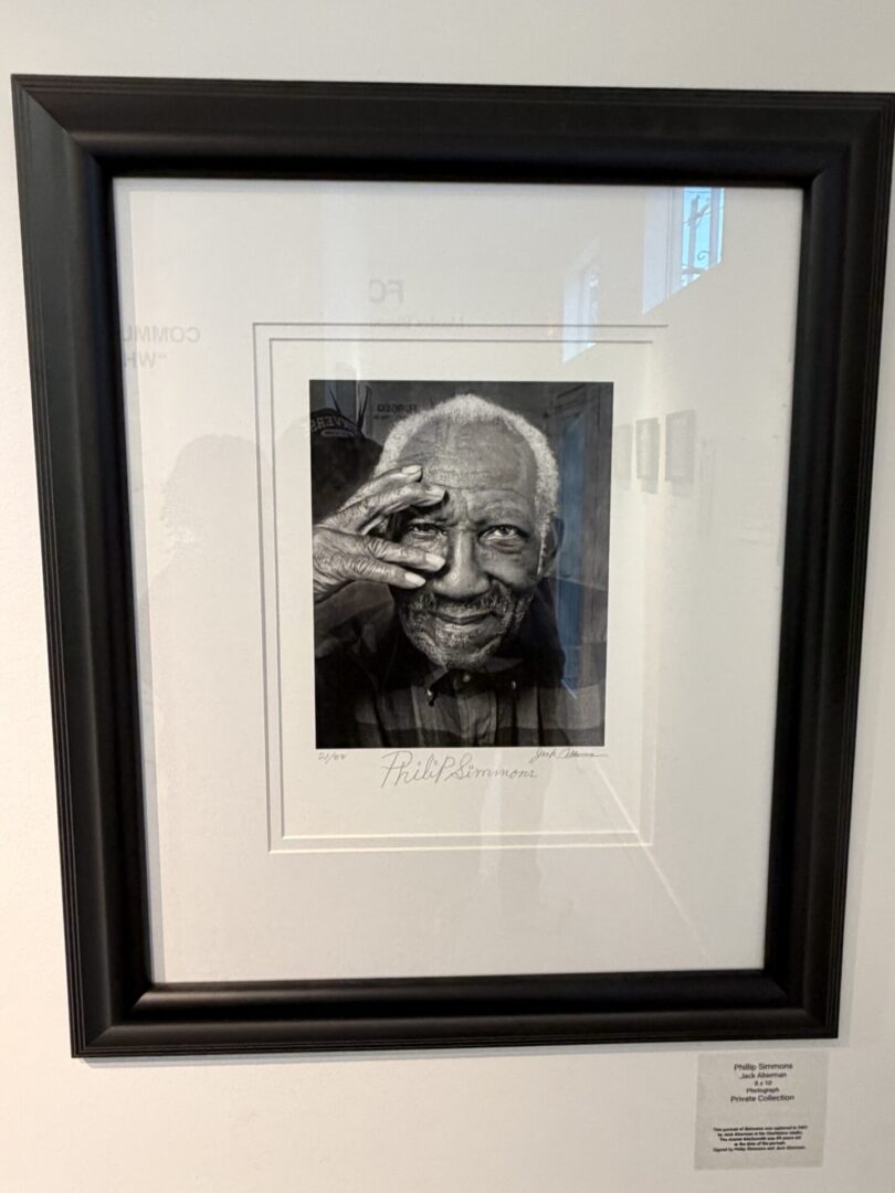 Framed black and white portrait of man.